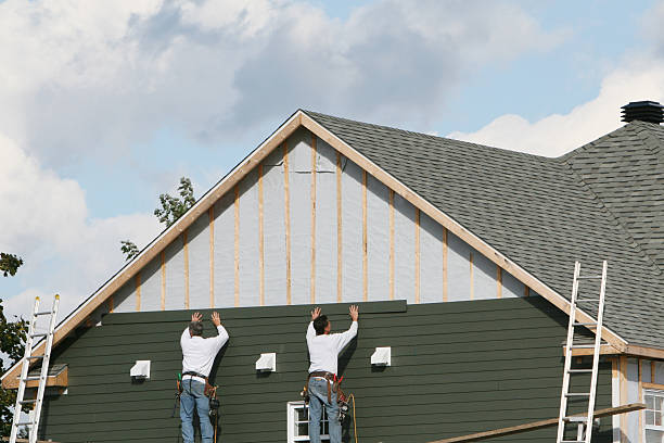 Professional Storm Damage Siding Repair technician working in Lancaster, OH